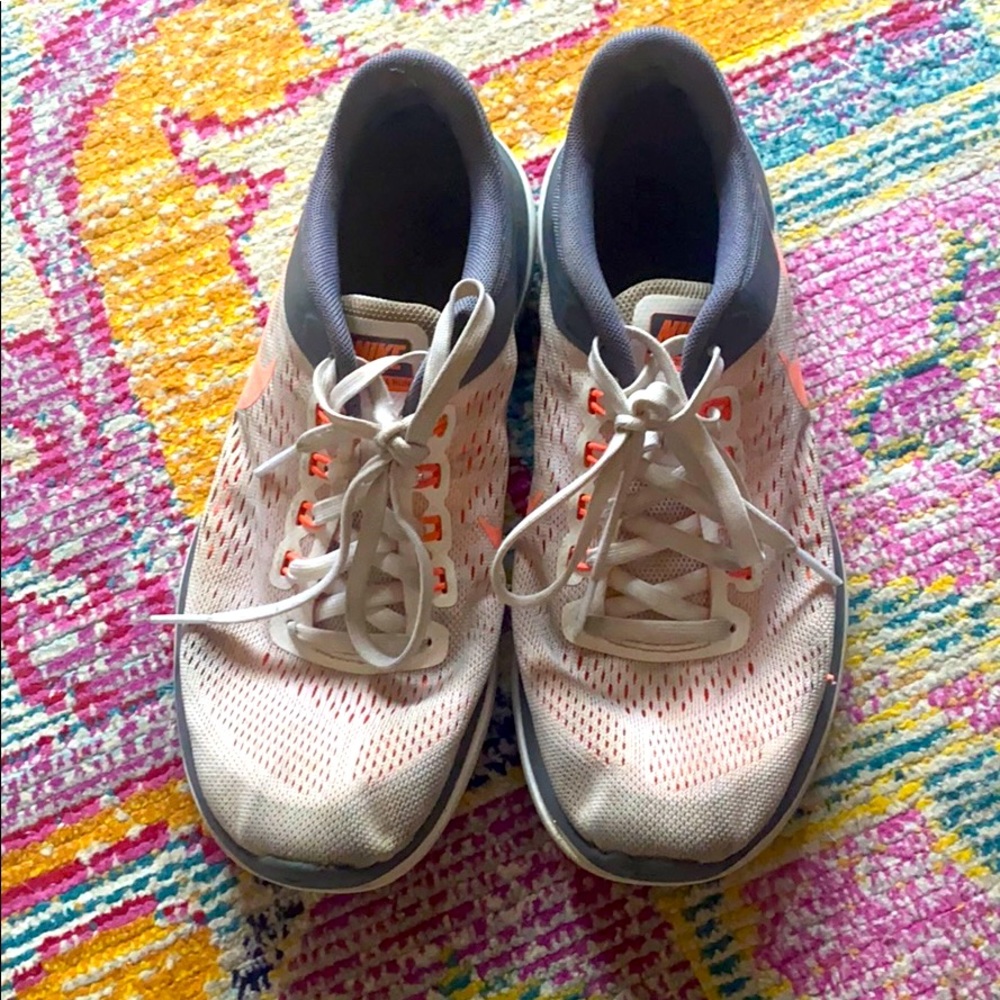 Orange Nike running shoes